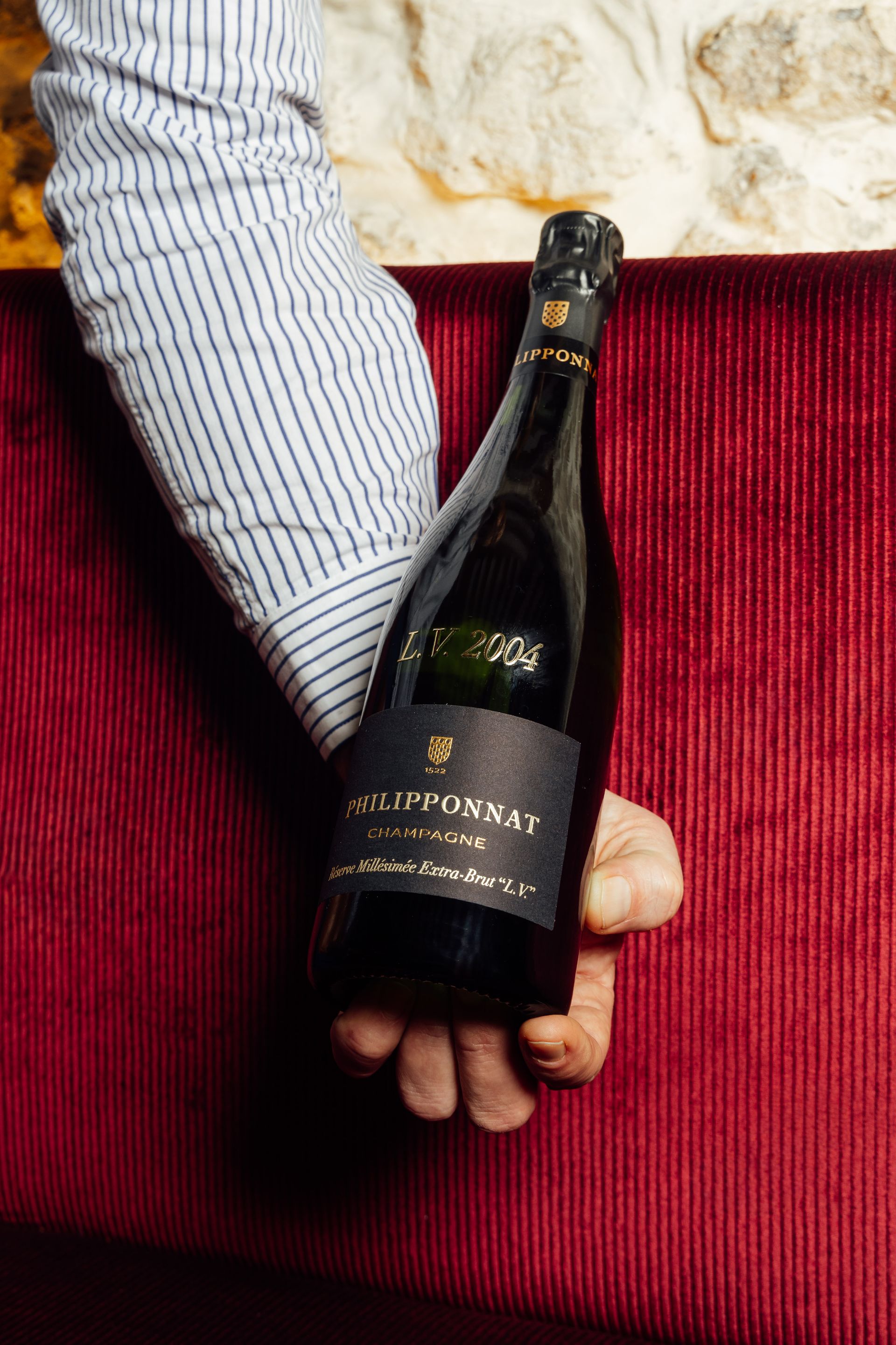 Champagne Philipponnat sur banquette rouge